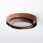 Clérachic ceiling light on a white backdrop, with its upper wood-grain ring and a smaller lower ring around a white diffuser.