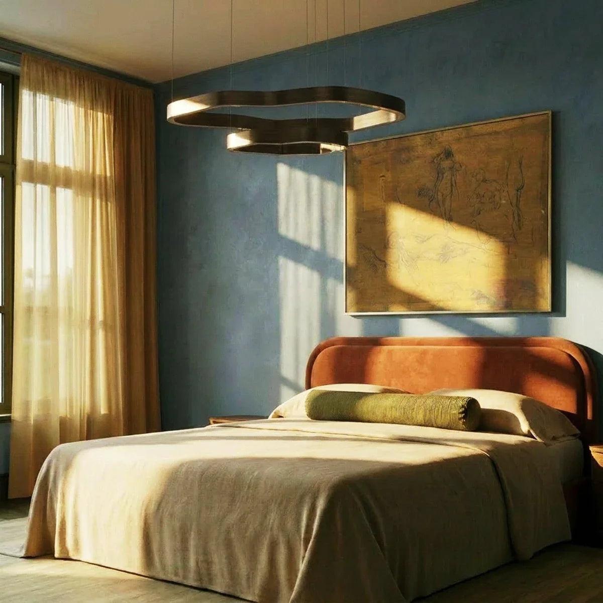 Clérachic two-ring chandelier in dark bronze above a bed with a rust headboard, against a blue plaster wall in low sun.