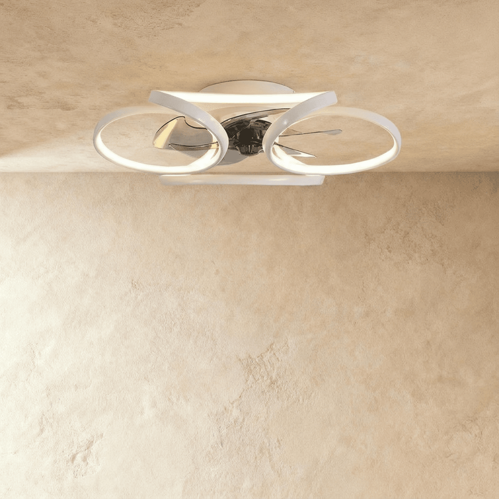 Clérachic larger white ceiling fan with a light in studio view, its looped LED bands wide around the central fan blades.