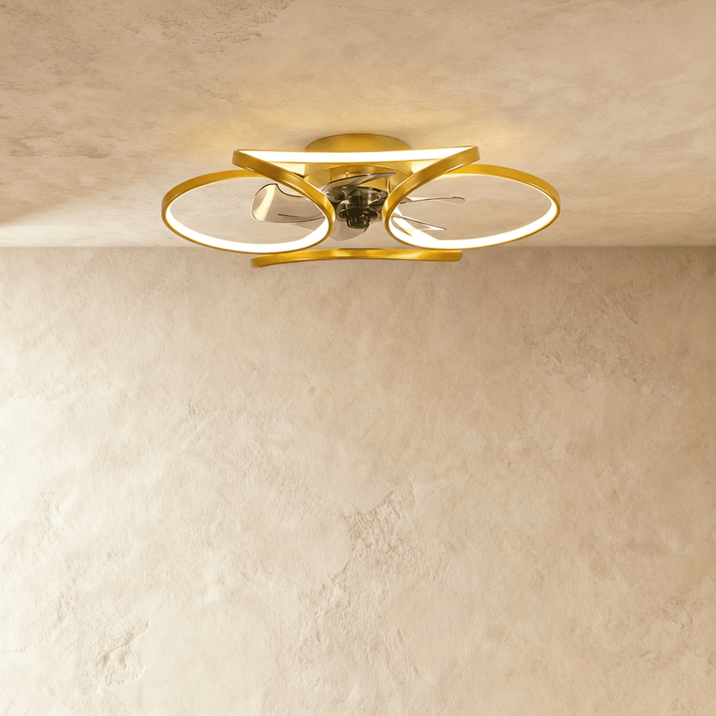 Clérachic larger gold ceiling fan with a light, wide looped LED bands around the central fan in studio light.