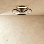 Clérachic ceiling fan with a light in black, with glowing looped LED bands wrapped around a central fan, in a studio.