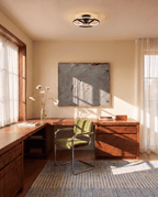 Clérachic black ceiling fan with a light above a walnut desk and green chair in a bright home office room.