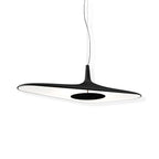 A black disc pendant with a white underside and a round dark centre plate hangs on its cable against a plain white backdrop, from Clérachic.