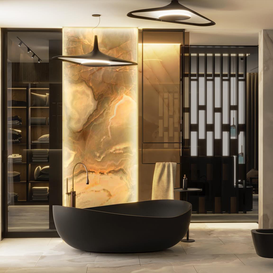 A black disc pendant hangs beside an onyx-lit panel and a black freestanding bath, with a second pendant overhead, from Clérachic.