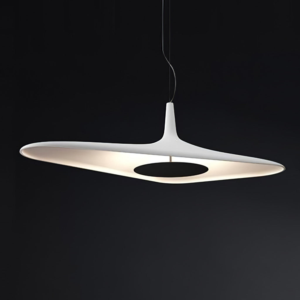 A white disc pendant with a black centre plate glows against a dark backdrop, its lit underside showing, from Clérachic.