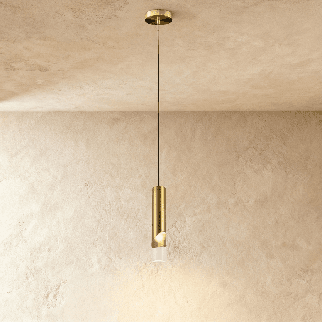 Clérachic single gold brass-tone cylinder pendant with a clear glass tip, hanging from a small round gold ceiling plate.