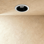 Clérachic recessed downlight switched off, showing a white trim ring around a matte black cone and a small silver reflector.