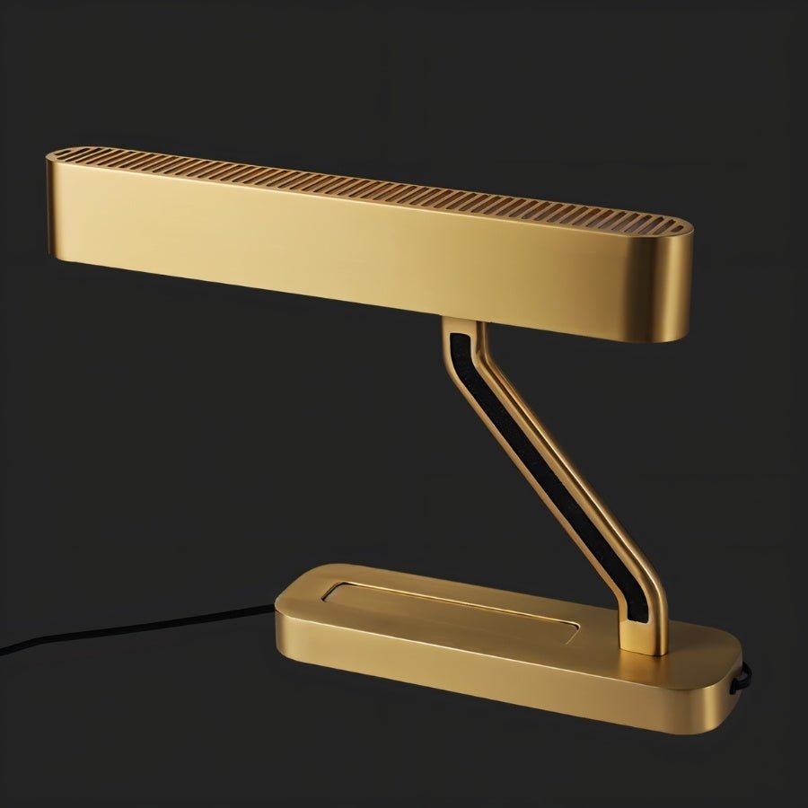 Clérachic Z-armed brass table lamp with a long grilled head and black cable, shown against a plain black background.