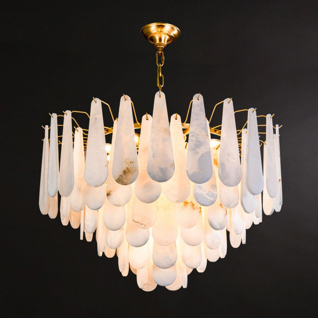 The Clérachic Leon chandelier on black, its stone drops layered in three deep tiers.