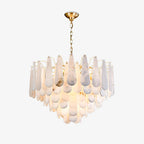 Clérachic Leon chandelier on white, brass chain above tiers of pale alabaster teardrops.
