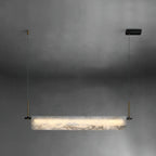 Clérachic Linear Alabaster LED Pendant Light on a soft grey studio backdrop, the full bar lit and hung level from its black driver box.