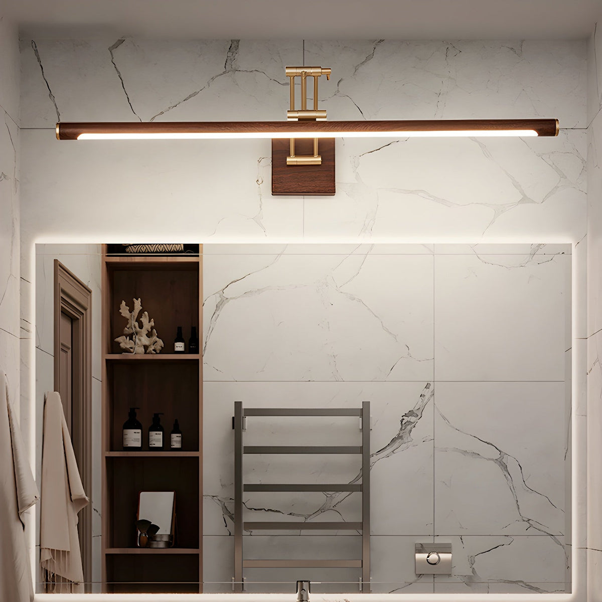 This Clérachic linear wall light runs above a large mirror in a marble-tiled bathroom, with open shelves and a towel rail beside it.
