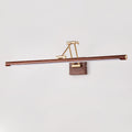 Straight-on view of this Clérachic linear wall light on a pale grey wall, its walnut tube centred on a brass arm and wall block.