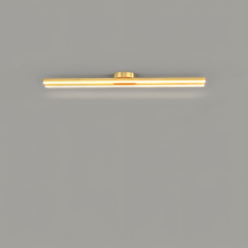 Clérachic single gold bar ceiling light with a small round canopy and a glowing frosted diffuser, on a plain grey ceiling.