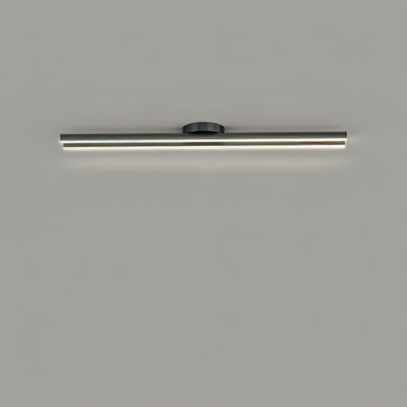 Clérachic single black bar ceiling light with a slim glowing frosted diffuser and a small round canopy, on a grey ceiling.