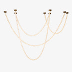 Four strands of the Clérachic alabaster bead chandelier cascade side by side from separate gold ceiling mounts.