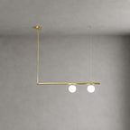 Clérachic chandelier with a single brass bar, two lit frosted globes and an L-shaped drop from a round canopy, on a grey wall.