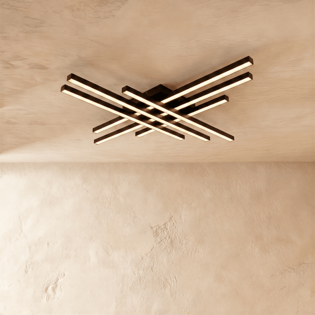 Clérachic black six-bar LED ceiling light, two layers of crossed aluminium bars glowing warm on a limewash ceiling.