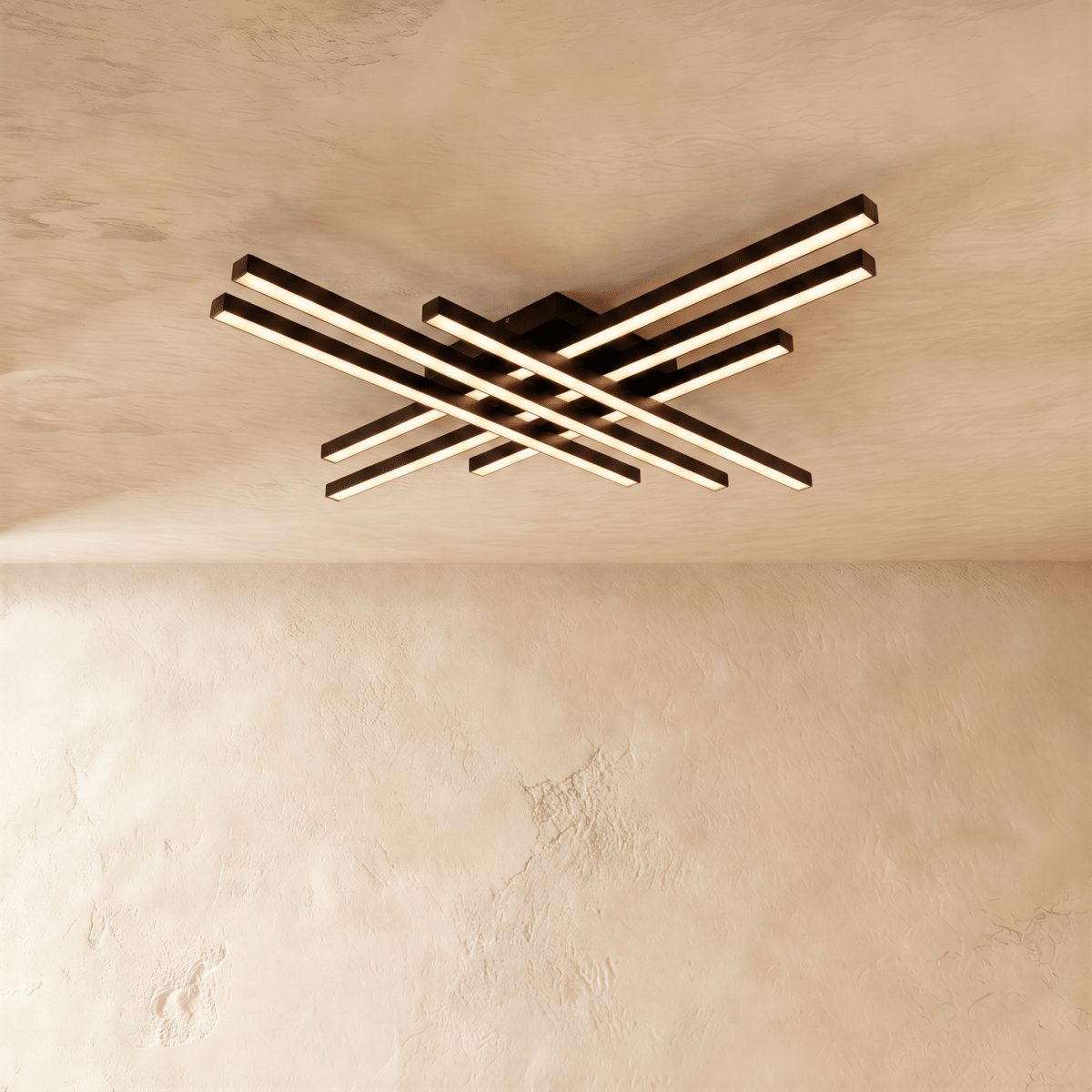 Clérachic black six-bar LED ceiling light, two layers of crossed aluminium bars glowing warm on a limewash ceiling.