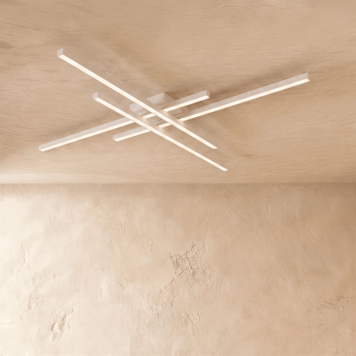 Clérachic white crossed-bar LED ceiling light in a long size, four lit bars reaching wide across a limewash ceiling.