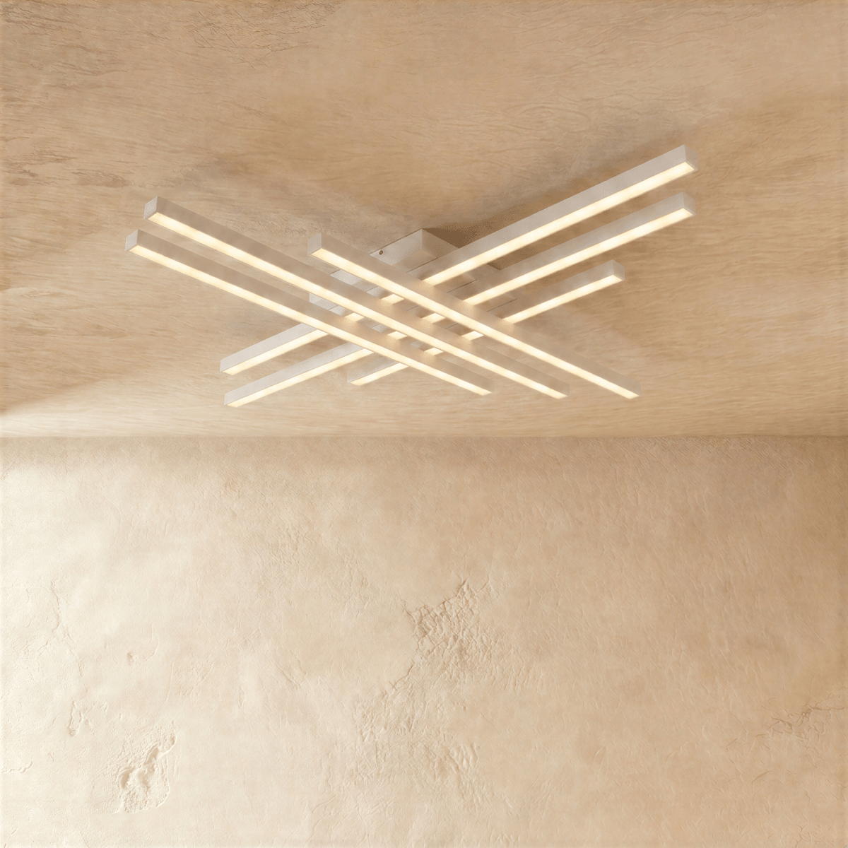 Clérachic wide white six-bar LED ceiling light, two tiers of crossed bars with soft frosted light on a limewash ceiling.