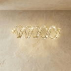 Clérachic double-wave spiral chandelier in gold, two intertwined crystal ribbons hung from five fine cables.