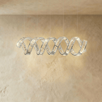 Clérachic double-wave spiral chandelier in chrome, two intertwined crystal ribbons on five fine cables.