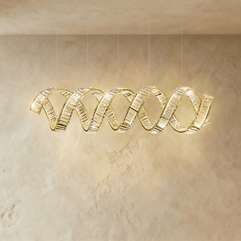 Clérachic wider double-wave spiral chandelier in gold, crystal ribbons twisting together with a soft warm glow.