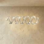 Clérachic wider double-wave spiral chandelier in chrome, twin crystal ribbons catching the light on five cables.