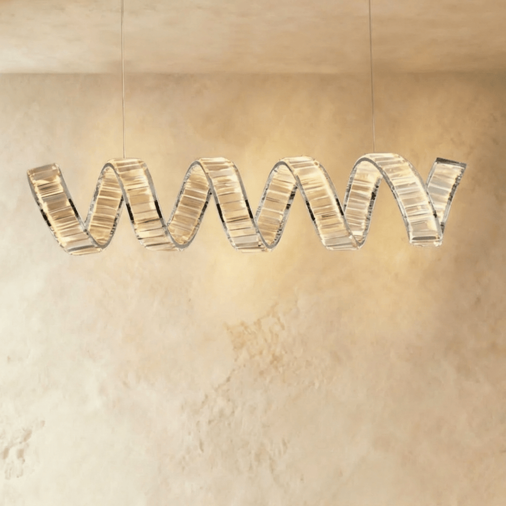 Clérachic longer single-wave spiral chandelier in chrome, clear crystal blocks glowing along a twisting ribbon.