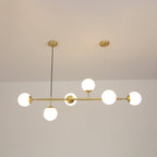 Bright opal white orbs lit against a warm beige wall, six of them spaced along the brass rod of this Clérachic pendant.