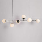 Opal white orbs, unlit, on a slim black bar with a black cord, in this Clérachic pendant against a plain grey backdrop.