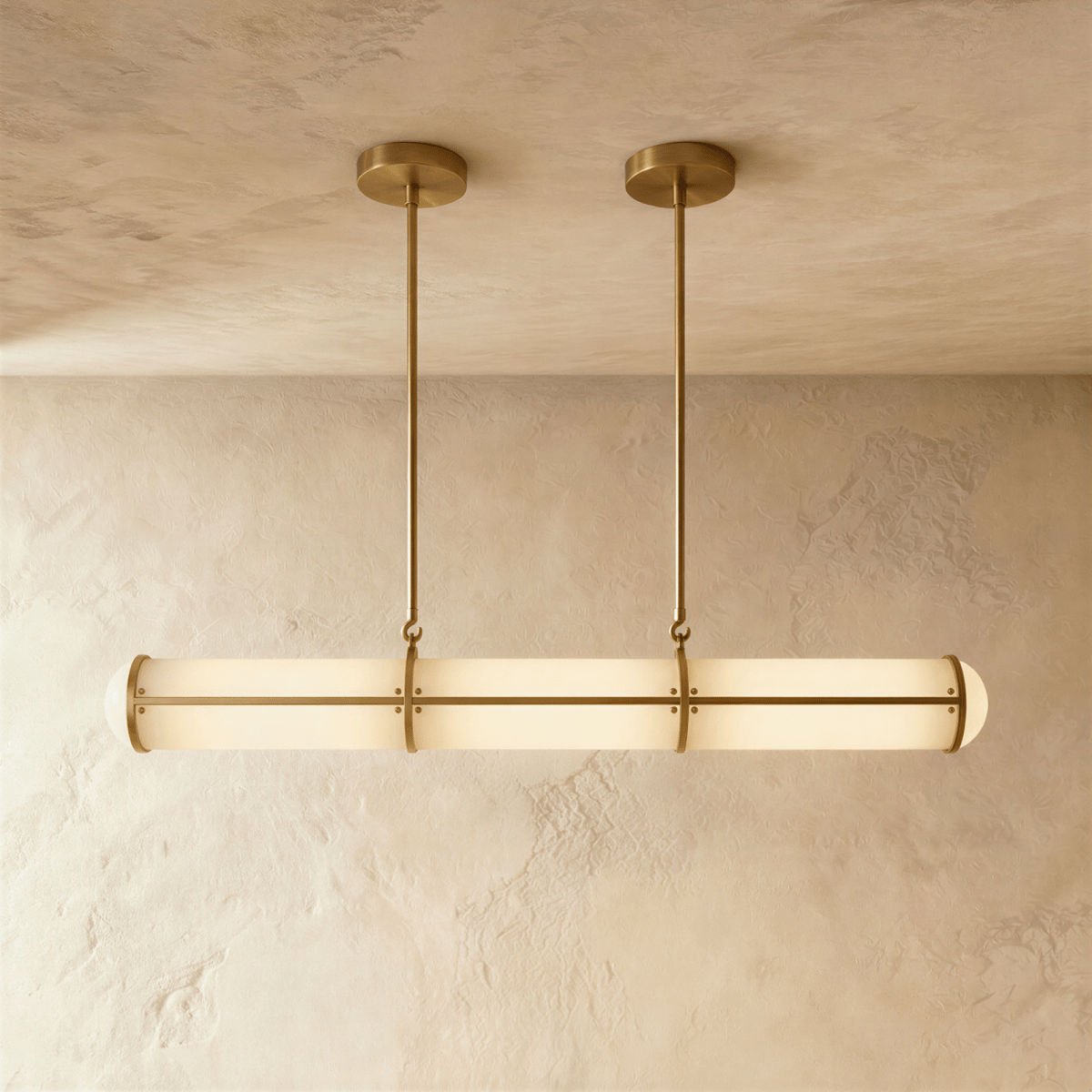 Clérachic opal tube pendant in a gold finish, its slim rods and ceiling plates echoing the banded frame over a plaster wall.