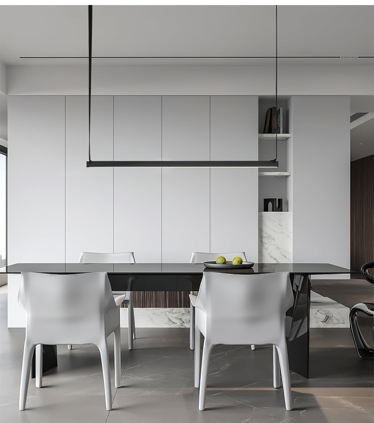 A single black bar from this Clérachic linear pendant light spans a dark dining table with white sculpted chairs.