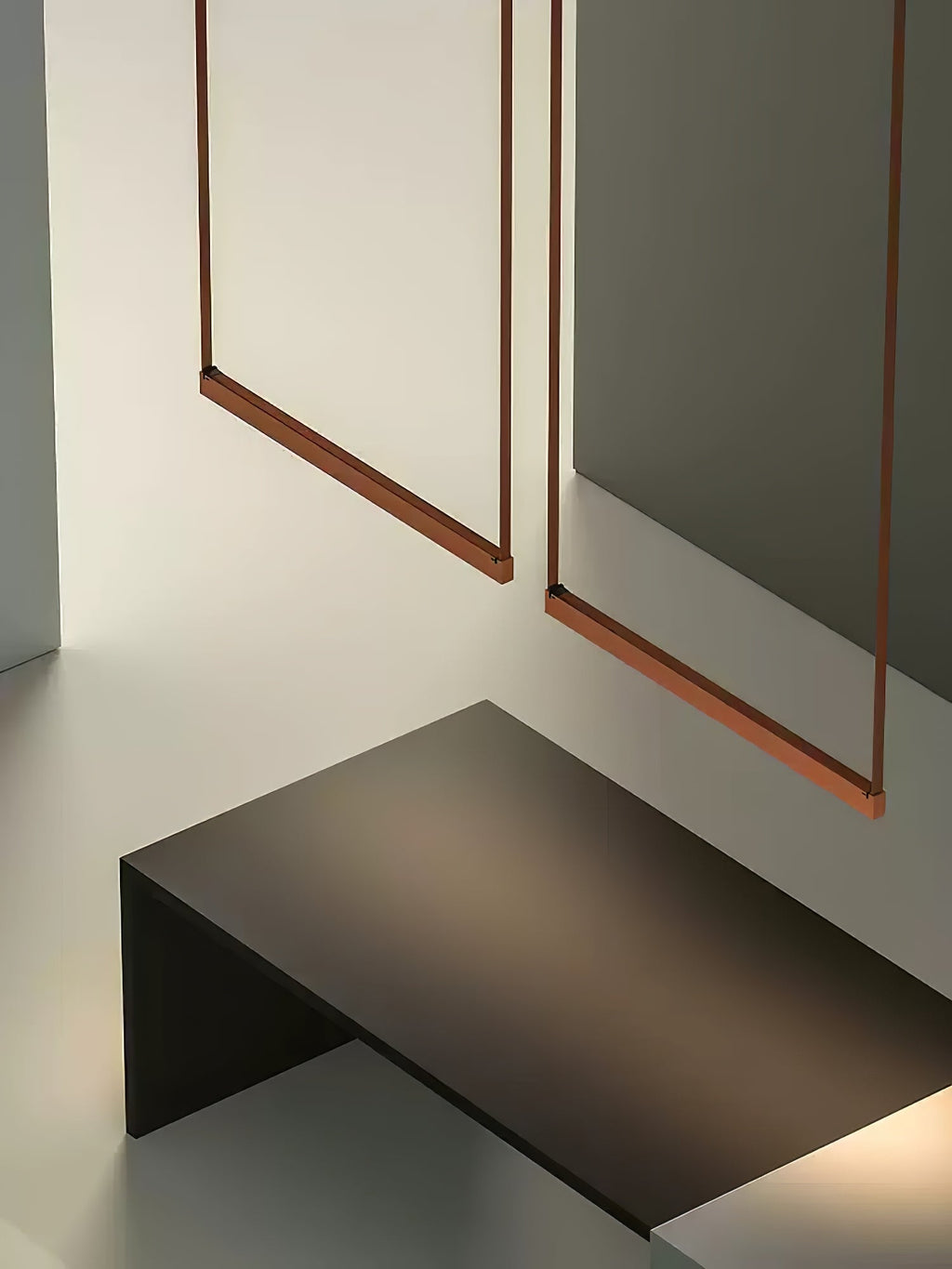 Two red bars of this Clérachic linear pendant light hang on straps above a low dark console in a muted green room.