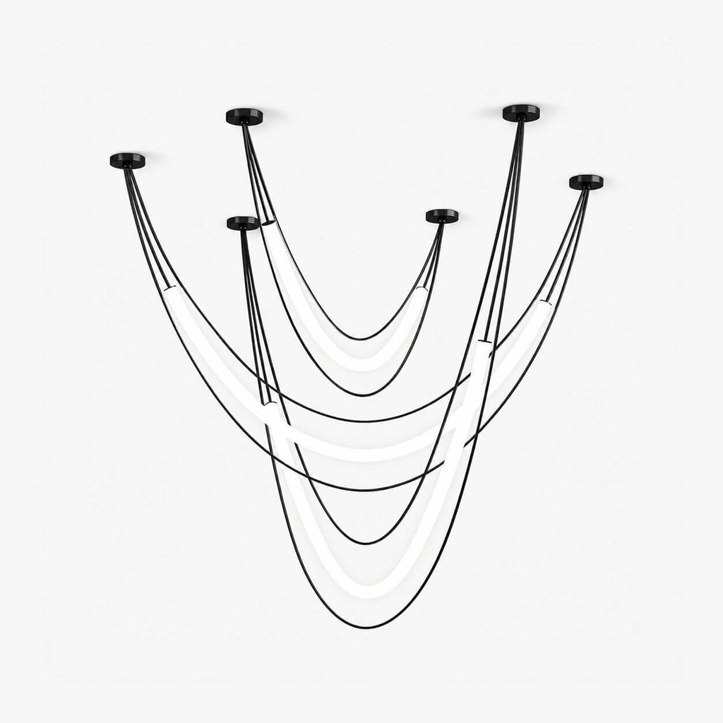 Black Clérachic linear pendant of several draped cords from ceiling canopies, with curved white LED tubes hanging between them, on white.