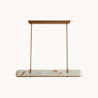 Long Clérachic pendant with a white alabaster-look shade and copper-toned arms and canopy, on a plain white backdrop.
