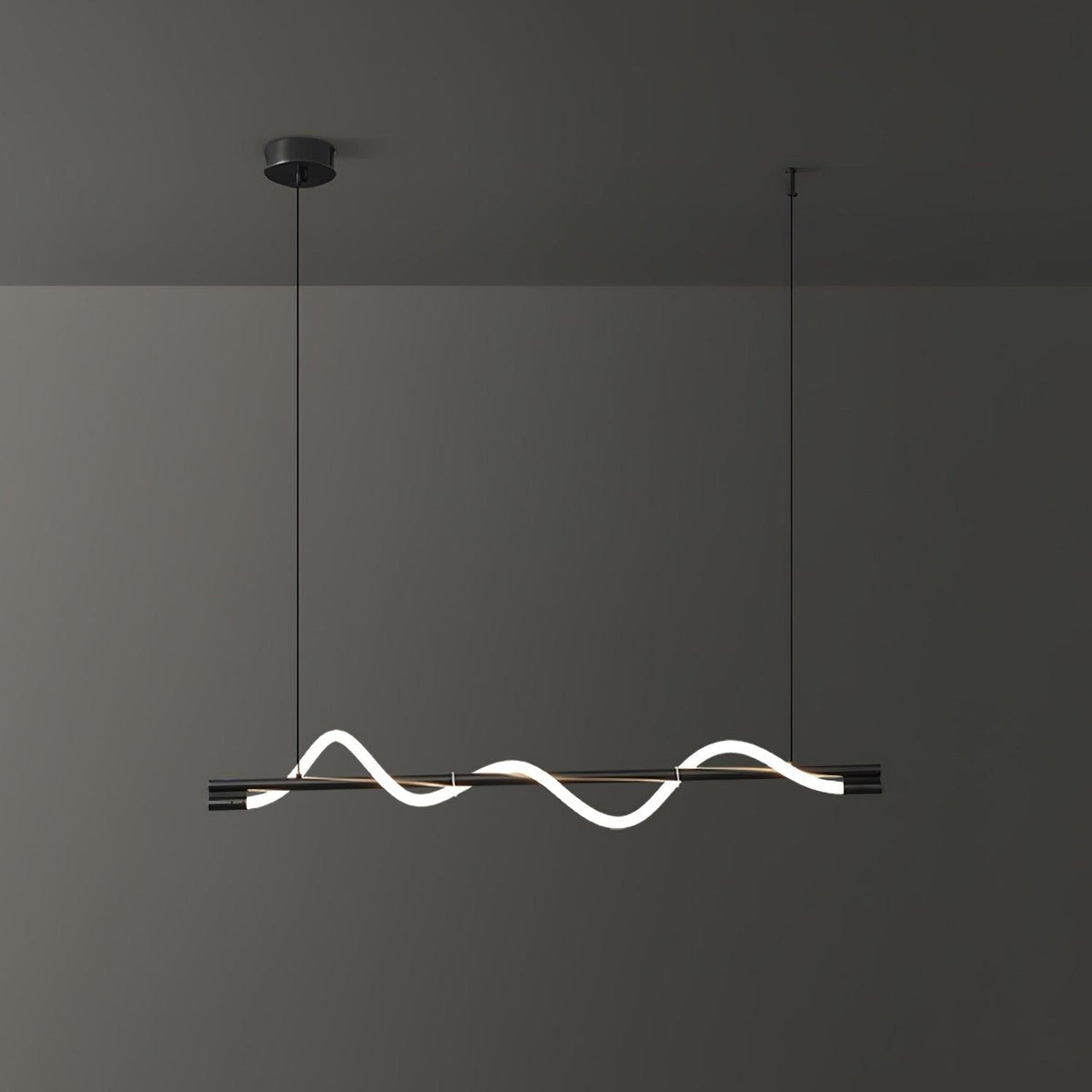 Black Clérachic linear pendant with a glowing white wave, on a black canopy against a dark grey wall.