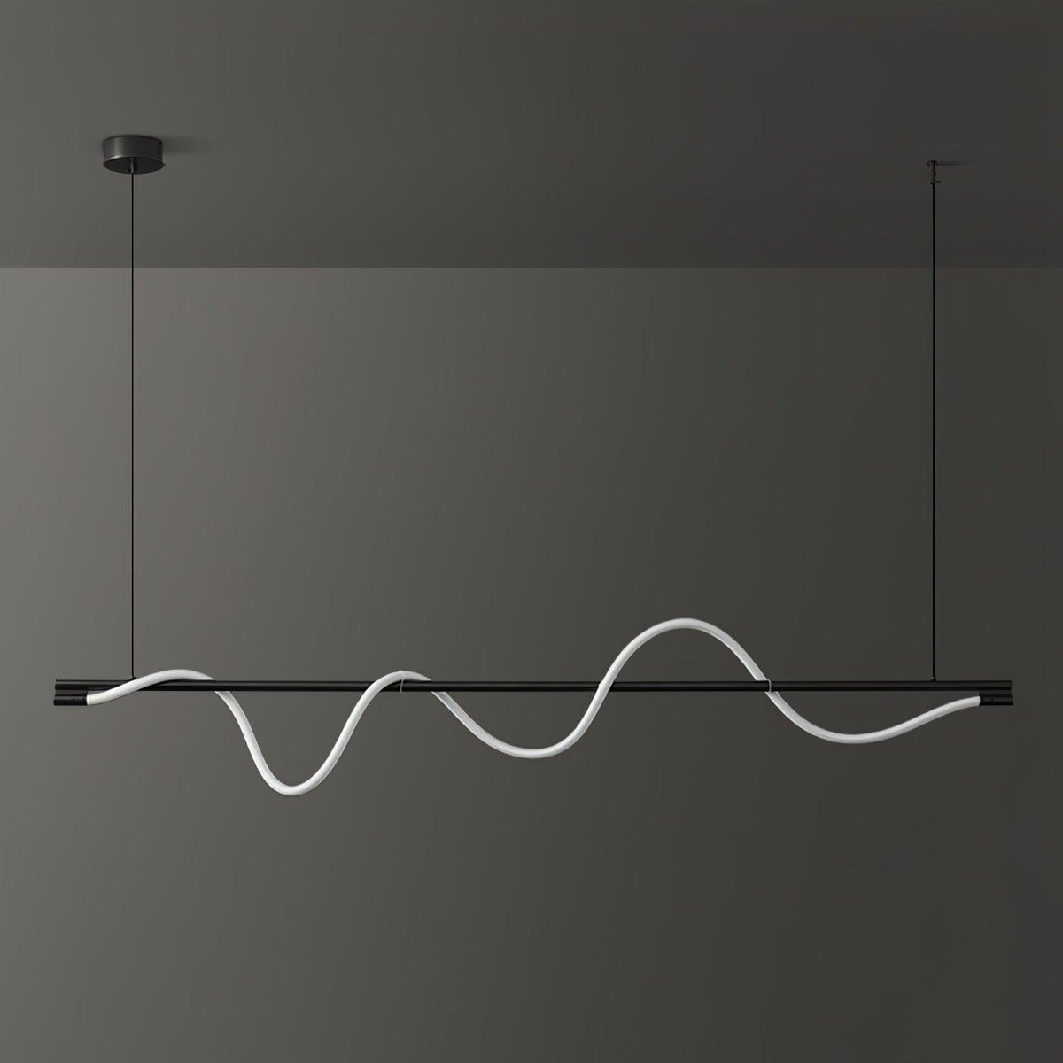 Black Clérachic linear pendant with a tall, glowing wave, in front of a dark charcoal wall.