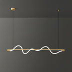 Brass Clérachic linear pendant lit with a deep wave, on a brass canopy against a dark grey wall.