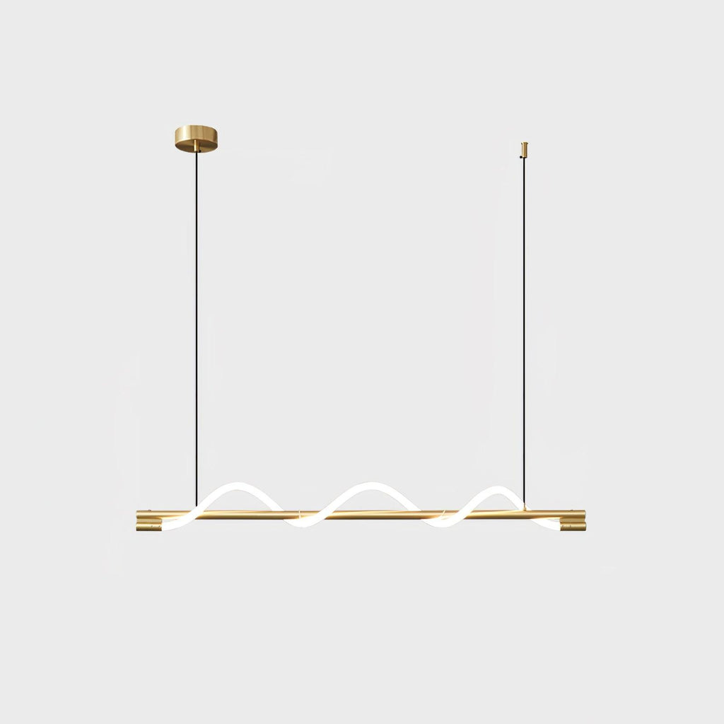 Brass Clérachic linear pendant with a low glowing wave and a round brass canopy, on a pale backdrop.