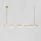 Brass Clérachic linear pendant with a glowing wave looping above and below the bar, on a pale grey backdrop.