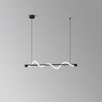 Black Clérachic linear pendant with a small glowing wave, on a black canopy against a grey wall.