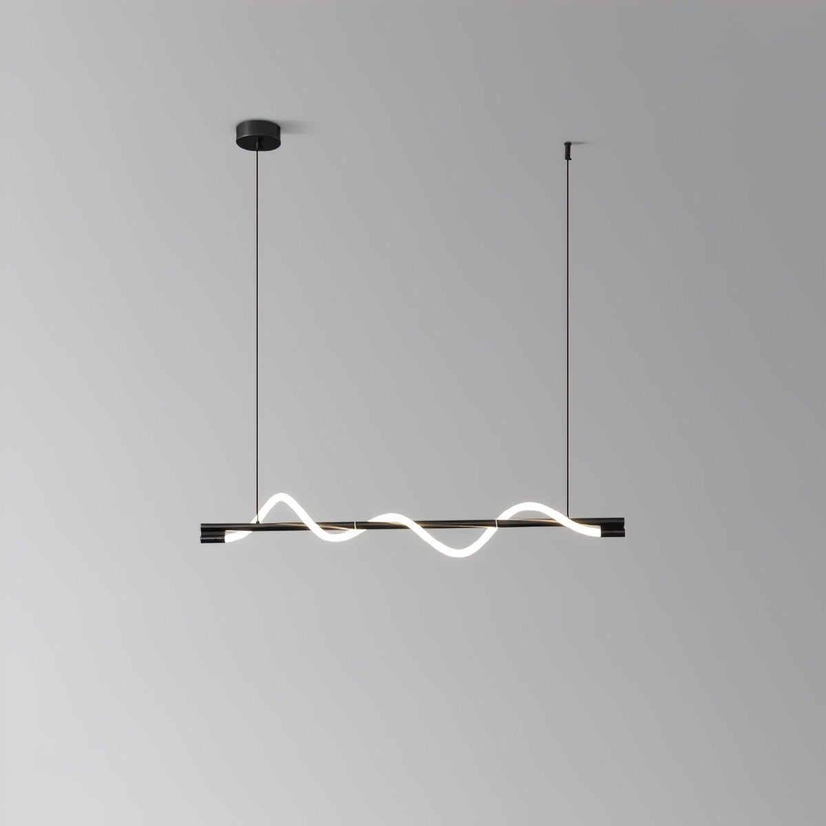 Black Clérachic linear pendant with a small glowing wave, on a black canopy against a grey wall.