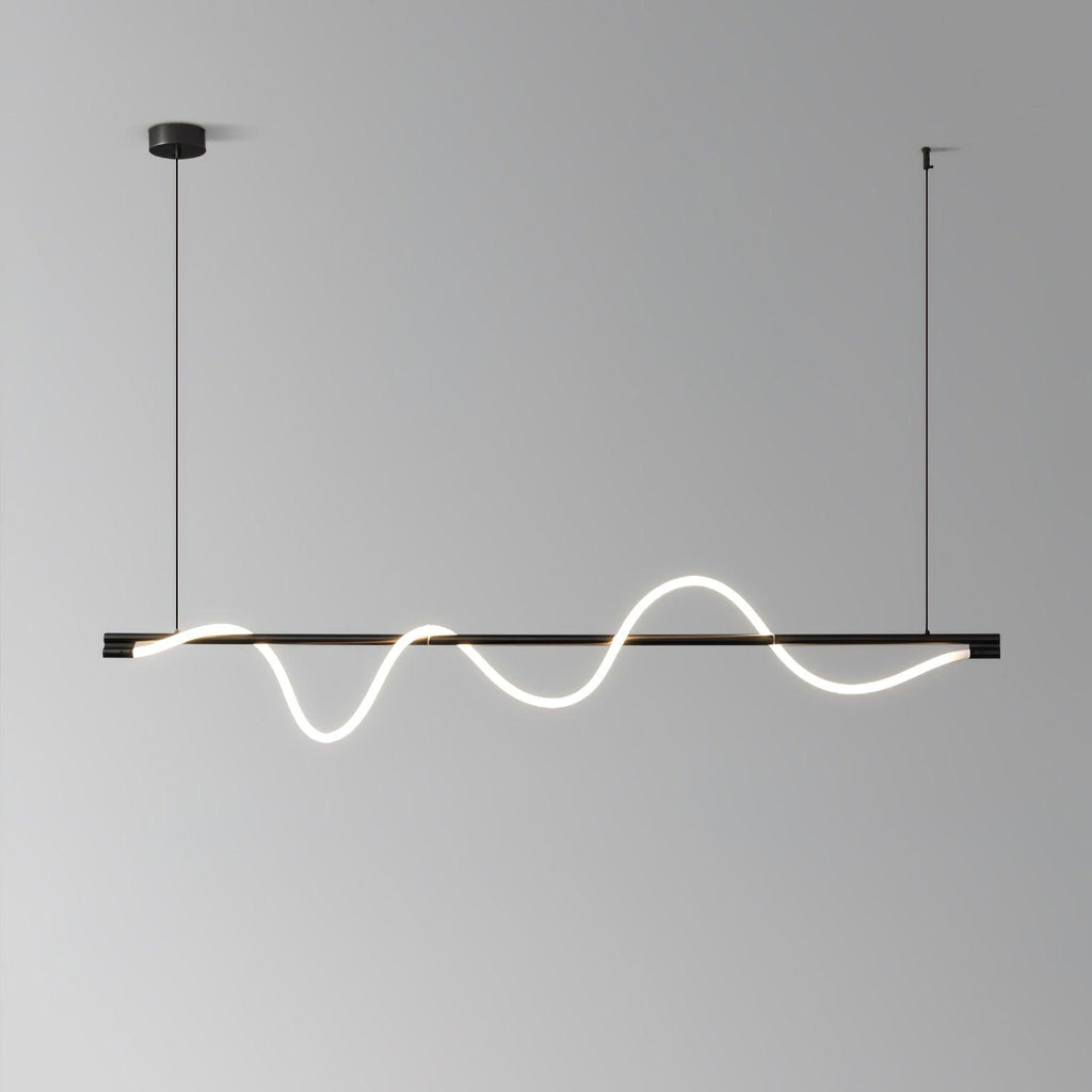 Black Clérachic linear pendant with a deep, glowing wave, in front of a grey gradient wall.