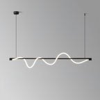 Black Clérachic linear pendant with a deep, glowing wave, in front of a grey gradient wall.
