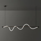 Wide view of a black Clérachic linear pendant with a bright, deep wave, in front of a dark grey wall.