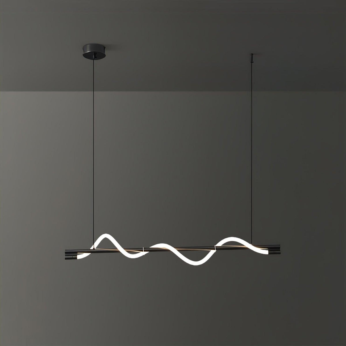 Clérachic black linear pendant angled slightly, with a glowing wave and a black canopy, on a dark wall.