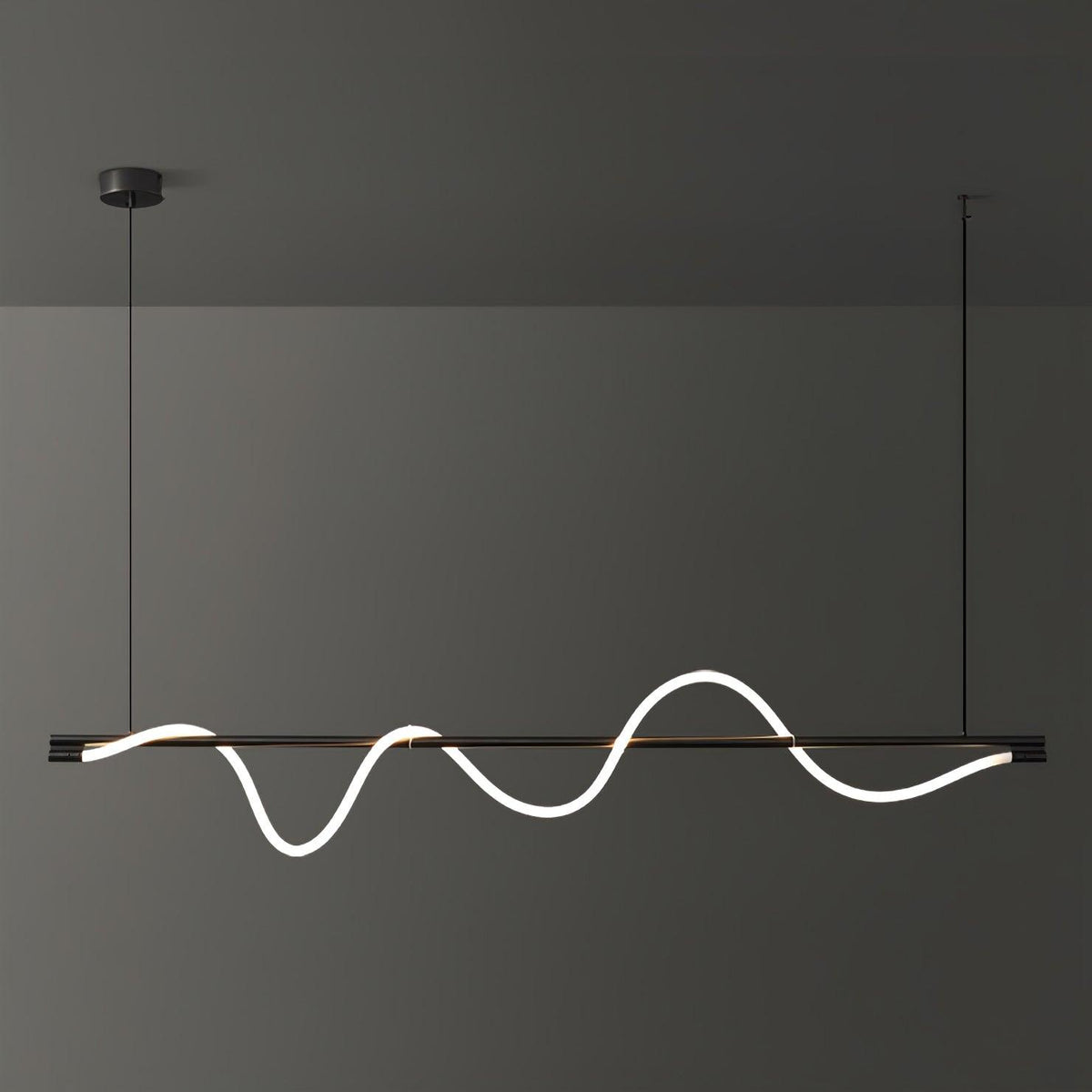 Black Clérachic linear pendant with a bright, deep wave and a black canopy, against a charcoal wall.