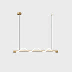 Brass Clérachic linear pendant with three small glowing waves and a round brass canopy, on a light backdrop.